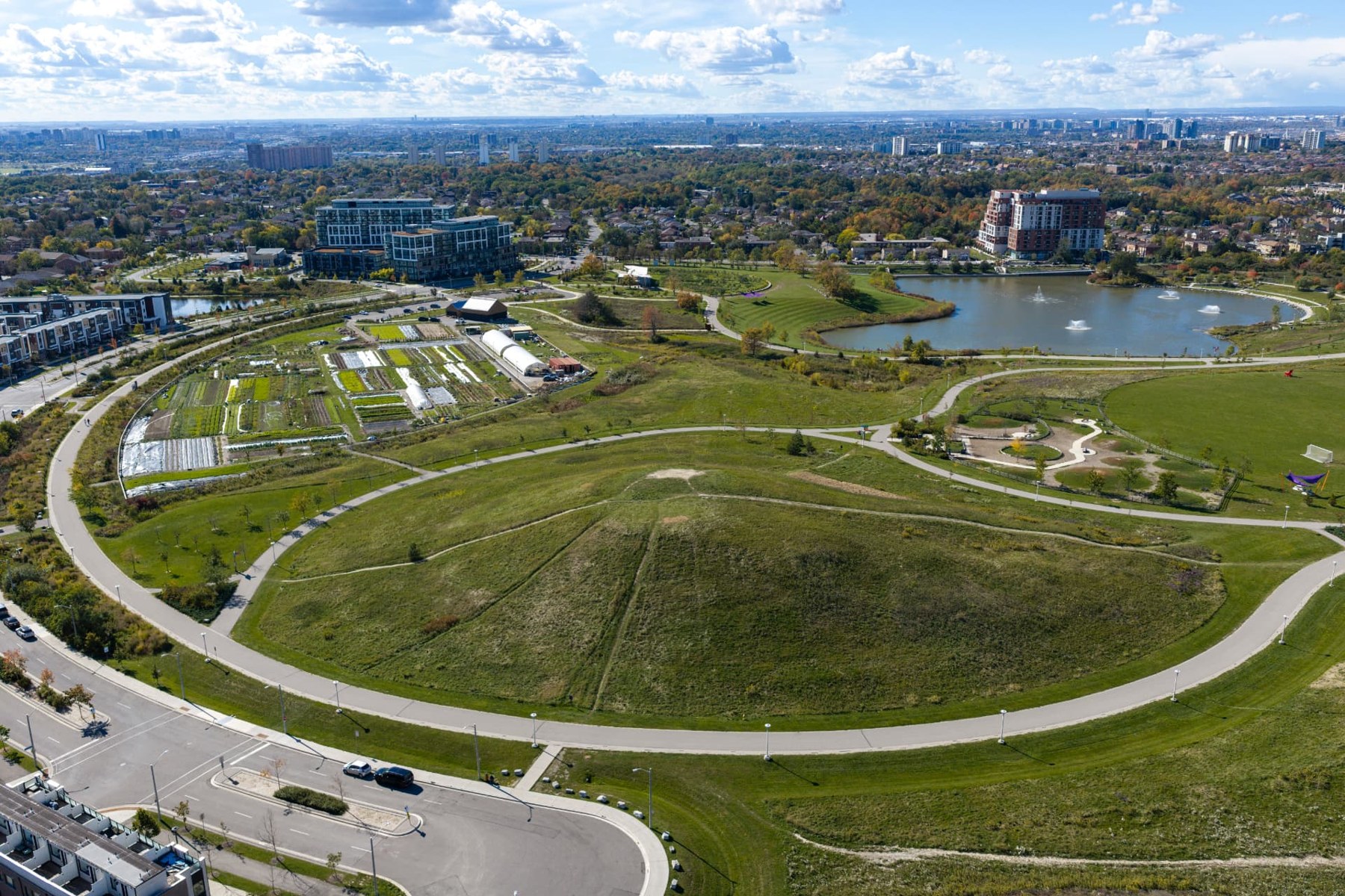 Aerial view of Downsview Park's circular pathways, lawns and lake